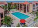 Communal pool with surrounding lounge chairs and patio at 8901 Blind Pass Rd # 228, St Pete Beach, FL 33706