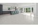 Open kitchen featuring an island with a wine cooler, stainless appliances, and seating at 15810 2Nd E St, Redington Beach, FL 33708