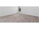 Spacious bedroom with neutral carpeting and window at 5381 Ulysses St, Port Charlotte, FL 33981