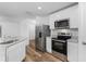 Modern kitchen featuring stainless steel appliances and granite countertops at 5381 Ulysses St, Port Charlotte, FL 33981