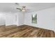 Living room featuring wood-look flooring and a ceiling fan at 5381 Ulysses St, Port Charlotte, FL 33981