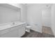 Clean bathroom with white vanity and a walk-in closet at 5389 Ulysses St, Port Charlotte, FL 33981