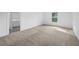 Bright bedroom with neutral carpet and access to the bathroom at 5389 Ulysses St, Port Charlotte, FL 33981