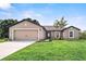 Newly constructed home with a two-car garage and well-manicured lawn at 5389 Ulysses St, Port Charlotte, FL 33981