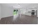 Open concept living room and kitchen with vinyl plank flooring at 5389 Ulysses St, Port Charlotte, FL 33981