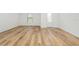 Spacious living room with light brown vinyl plank flooring at 5413 Dayton Ln, Port Charlotte, FL 33981