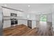 Open concept kitchen with stainless steel appliances and island at 5413 Dayton Ln, Port Charlotte, FL 33981