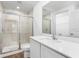 Clean bathroom with a walk-in shower and modern vanity at 12157 Shellnut Ave, Port Charlotte, FL 33981