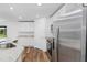 Modern kitchen with white cabinets, stainless steel appliances and granite countertops at 12157 Shellnut Ave, Port Charlotte, FL 33981