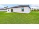 Newly constructed home with grassy backyard and patio at 5373 Ulysses St, Port Charlotte, FL 33981