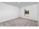 Bedroom with neutral carpet and a window with blinds at 5373 Ulysses St, Port Charlotte, FL 33981