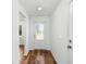 Bright entryway with wood-look flooring and a white door at 5373 Ulysses St, Port Charlotte, FL 33981