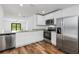Modern kitchen featuring stainless steel appliances and granite countertops at 5373 Ulysses St, Port Charlotte, FL 33981