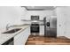 Modern kitchen with stainless steel appliances and granite countertops at 5373 Ulysses St, Port Charlotte, FL 33981