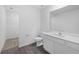 Clean bathroom with white vanity, toilet and grey flooring at 12169 Patterson Ave, Port Charlotte, FL 33981