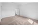 Well-lit bedroom with neutral carpeting and ample space at 12169 Patterson Ave, Port Charlotte, FL 33981