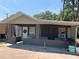 House exterior with covered porch and landscaping at 36940 Howard Ave, Dade City, FL 33525