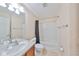 Clean bathroom with a shower-tub combo, vanity, and towel bars at 2220 Kings Palace Dr, Riverview, FL 33578