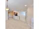 Inviting living room with modern lighting, stairs, and a view of the kitchen at 2220 Kings Palace Dr, Riverview, FL 33578
