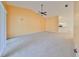 Spacious living room boasting a ceiling fan and access to the kitchen and breakfast bar at 2220 Kings Palace Dr, Riverview, FL 33578