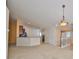 Open-concept living room with plush carpet, staircase, and modern lighting fixture above at 2220 Kings Palace Dr, Riverview, FL 33578