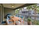 Outdoor patio with dining table, chairs, ceiling fan and lush greenery at 2220 Kings Palace Dr, Riverview, FL 33578