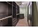 Walk-in closet with custom shelving and drawers that maximizes storage space at 2220 Kings Palace Dr, Riverview, FL 33578