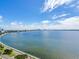 Panoramic water view of the coastline under a blue sky filled with puffy clouds at 3507 Bayshore Blvd # 2001, Tampa, FL 33629