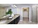 Elegant bathroom with double vanity, walk-in shower, and large closet at 32224 Cannon Rush Dr, San Antonio, FL 33576