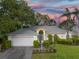 Charming single-story home with a well-maintained lawn, mature trees, and a two-car garage at 4787 Hamlets Grove Dr, Sarasota, FL 34235