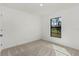 Well-lit bedroom with neutral carpet and window at 13208 Foresman Blvd, Port Charlotte, FL 33981