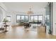 Bright living room with hardwood floors, city views, and a wine wall at 449 S 12Th St # 2405, Tampa, FL 33602