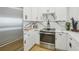 Modern kitchen with white cabinets and stainless steel appliances at 449 S 12Th St # 2405, Tampa, FL 33602
