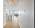 Bright and airy entryway with light hardwood floors, marble kitchen counter, and modern light fixture at 449 S 12Th St # 2405, Tampa, FL 33602