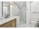 Modern bathroom with double vanity, marble shower, and white toilet at 449 S 12Th St # 2405, Tampa, FL 33602