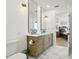 Bathroom with double vanity and view into bedroom at 449 S 12Th St # 2405, Tampa, FL 33602