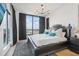Spacious main bedroom with large bed, city view, and dark wood dresser at 449 S 12Th St # 2405, Tampa, FL 33602