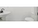 Clean powder room with pedestal sink, toilet, and dark bronze faucet at 449 S 12Th St # 2405, Tampa, FL 33602