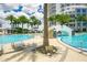 Resort-style pool area with multiple lounging chairs and tropical landscaping at 449 S 12Th St # 2405, Tampa, FL 33602