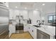 Modern kitchen with white cabinets, quartz countertops, and stainless steel appliances at 449 S 12Th St # 2405, Tampa, FL 33602