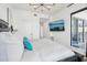 Bright bedroom with a large bed, wall-mounted TV, and access to balcony at 449 S 12Th St # 2405, Tampa, FL 33602