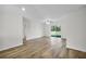Bright and spacious living area with wood-look flooring and sliding glass doors at 5952 Gillot Blvd, Port Charlotte, FL 33981