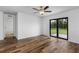 Bedroom with wood-look flooring and sliding glass doors at 5952 Gillot Blvd, Port Charlotte, FL 33981