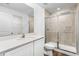 Clean bathroom with a walk-in shower and white vanity at 5952 Gillot Blvd, Port Charlotte, FL 33981