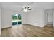 Large bedroom with wood-look flooring and access to the backyard at 5952 Gillot Blvd, Port Charlotte, FL 33981