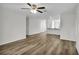 Open living room with wood-look flooring and kitchen views at 5952 Gillot Blvd, Port Charlotte, FL 33981