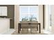 Bright dining area with a wooden table and wicker chairs at 10439 Lavender Aster Trl, San Antonio, FL 33576