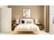Well-lit bedroom with a full-size bed and stylish decor at 10439 Lavender Aster Trl, San Antonio, FL 33576