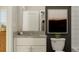 Modern bathroom features a single vanity, toilet, and shower/tub combo at 10439 Lavender Aster Trl, San Antonio, FL 33576