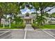 Community clubhouse with landscaping and parking at 906 Golfview Woods Dr # 906, Ruskin, FL 33573